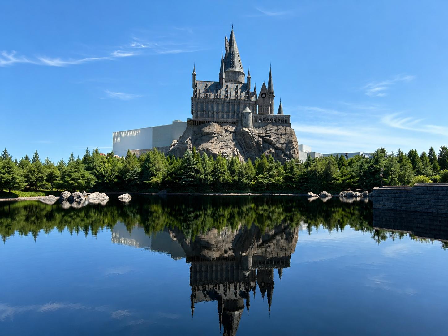 Hogwarts Castle reflected in lake at Universal Beijing theme park