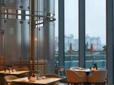 High-rise restaurant of Grand Canal hotel Hangzhou, floor-to-ceiling windows with canal city view