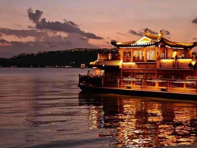 Traditional West Lake cruise at sunset