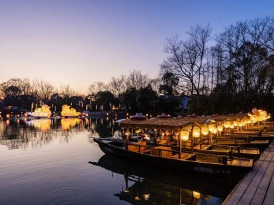 Lit wooden cruise boats at West Lake dock Lit wooden cruise boats at West Lake dock