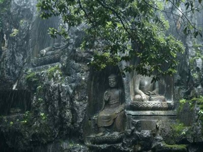Ancient stone Buddha statues carved on Feilai Peak cliff