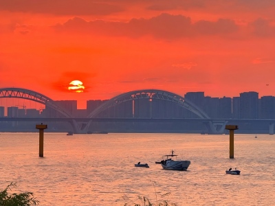 Fiery Sunset over Qiantang River Arch Bridge
