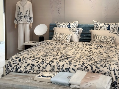 Silk bedding set with blue and white floral pattern displayed in a bedroom scene Silk bedding set with blue and white floral pattern displayed in a bedroom scene