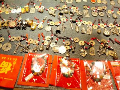 Handmade copper coin pendants symbolizing good fortune are sold at Wulin Night Market Handmade copper coin pendants symbolizing good fortune are sold at Wulin Night Market