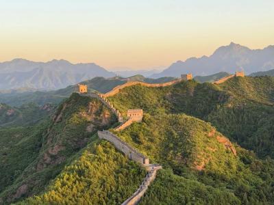 Distant view of the Mutianyu Great Wall at dusk