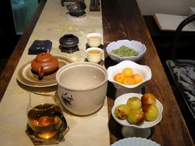 Chinese Tea Table with Teaware and Seasonal Fruits