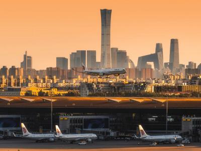 Planes take off from Beijing Capital International Airport and fly over Beijing CBD