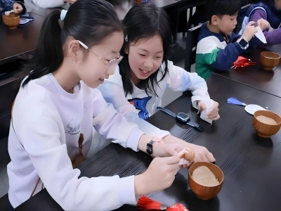 Children handcrafting traditional herbal sachets