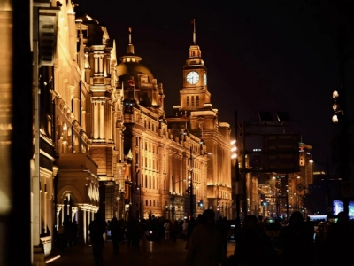 Row of classical heritage buildings on Shanghai Bund, night street silhouettes