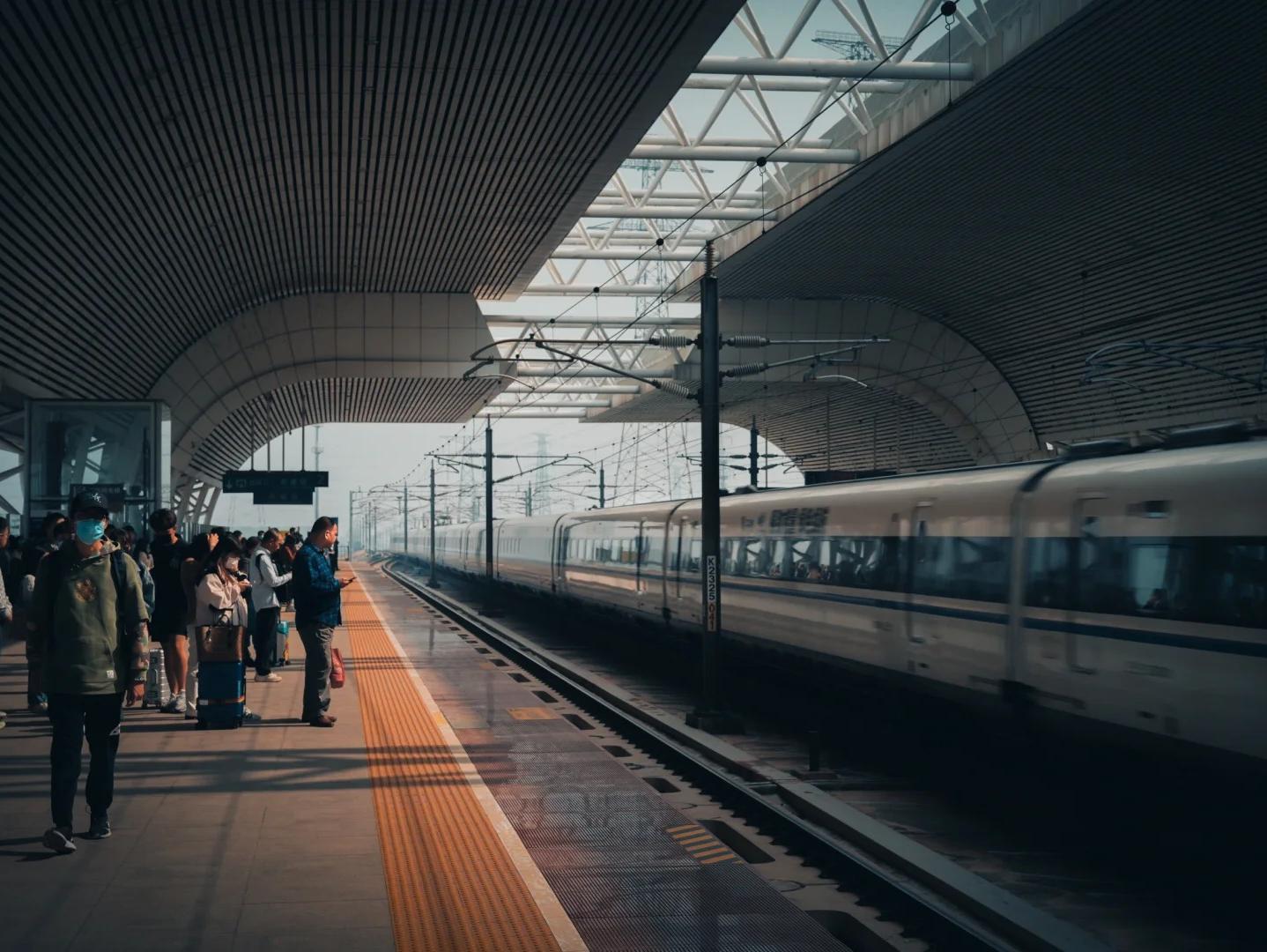 Passengers Waiting for High?Speed Train on Modern Railway Station Platform Passengers Waiting for High?Speed Train on Modern Railway Station Platform