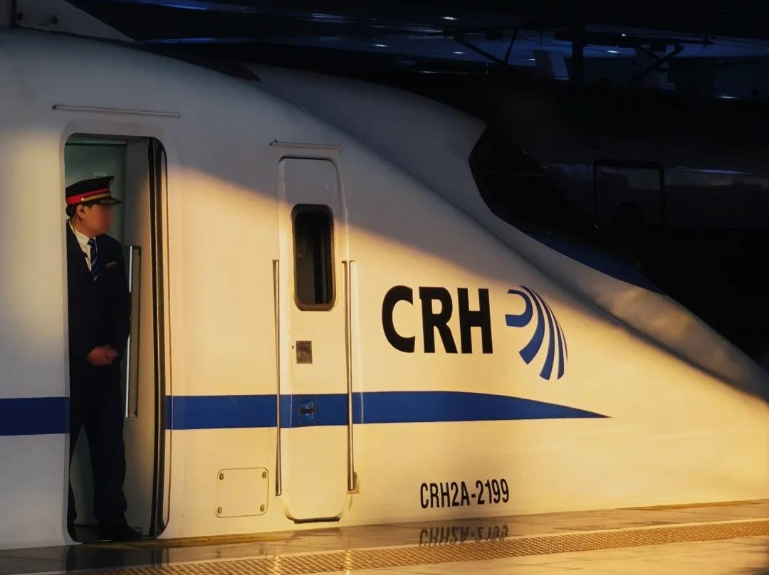 CRH2A?2199 CRH EMU Train with Railway Conductor at Station Platform