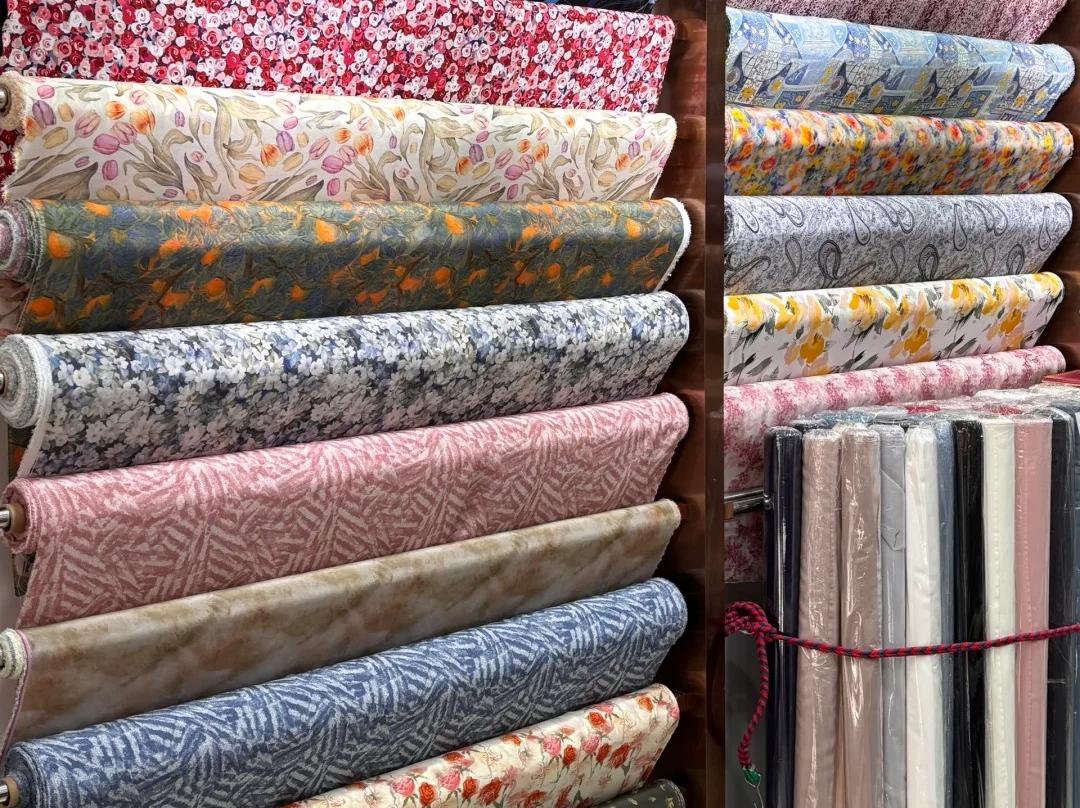 Assorted colorful printed silk fabric rolls in Hangzhou silk shop Assorted colorful printed silk fabric rolls in Hangzhou silk shop