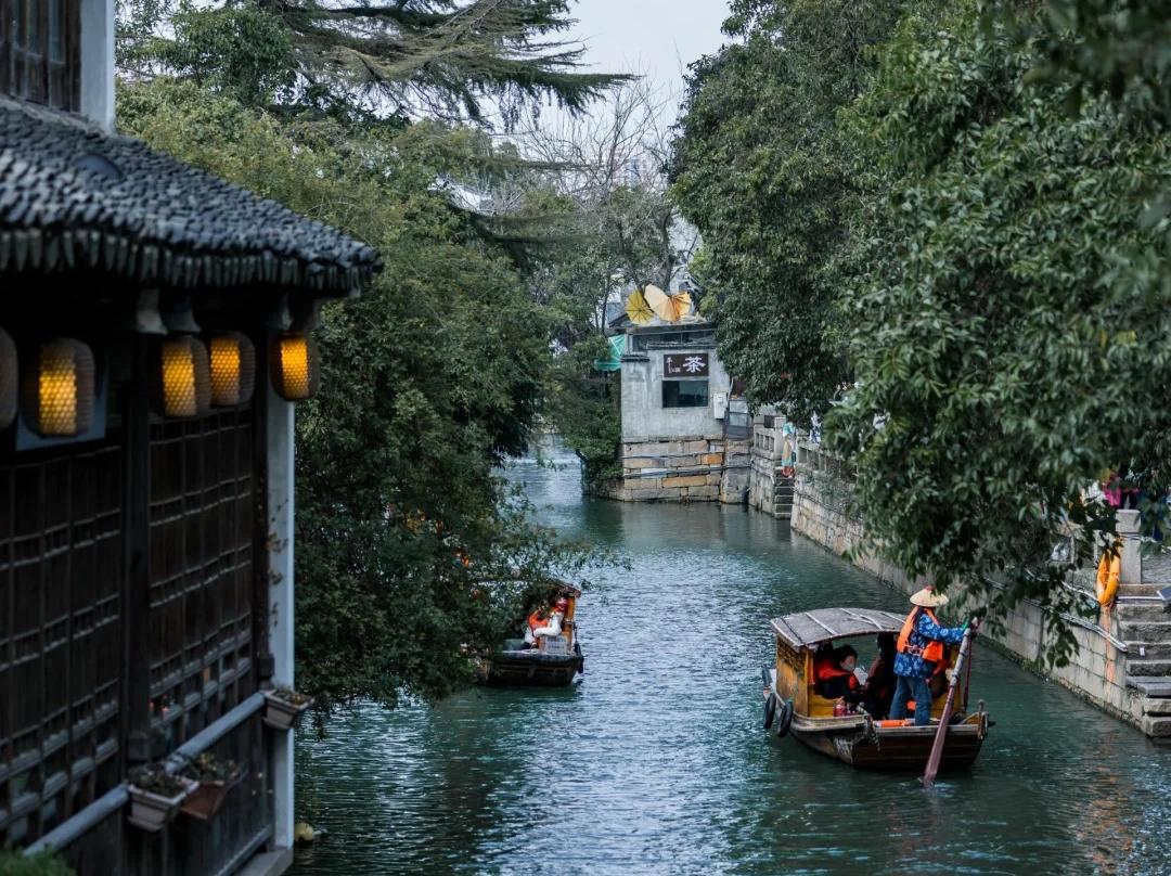 Tour rowing boats cruising Suzhou ancient water canal