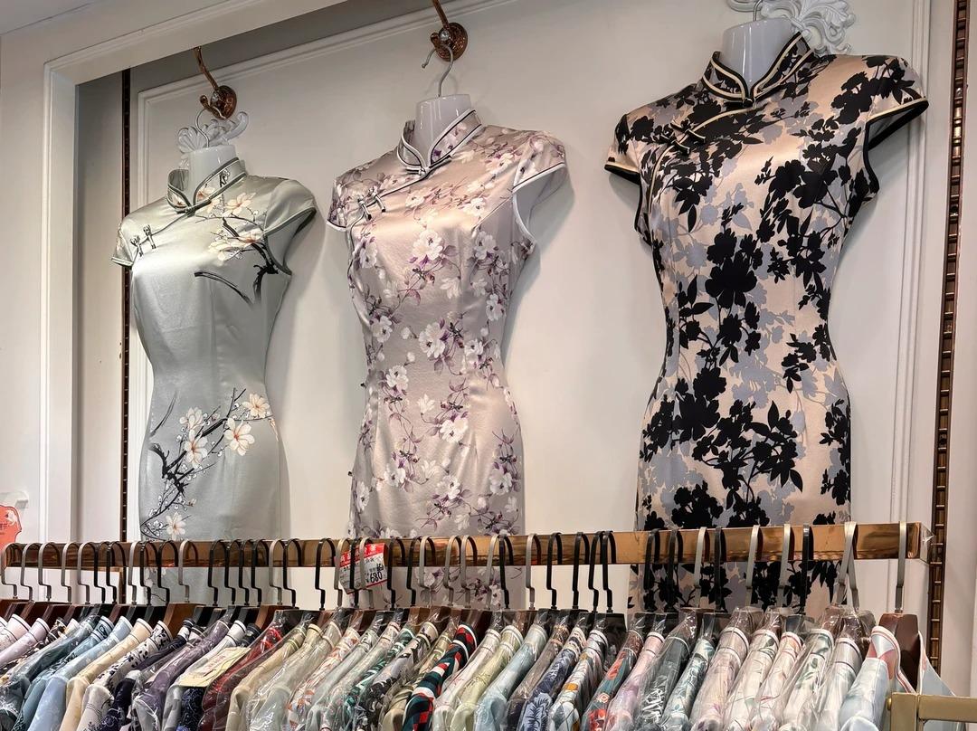 Patterned silk qipao cheongsam dresses displayed in Hangzhou silk market store Patterned silk qipao cheongsam dresses displayed in Hangzhou silk market store
