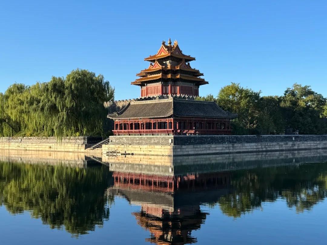 Ancient corner tower reflected in Forbidden City moat Ancient corner tower reflected in Forbidden City moat
