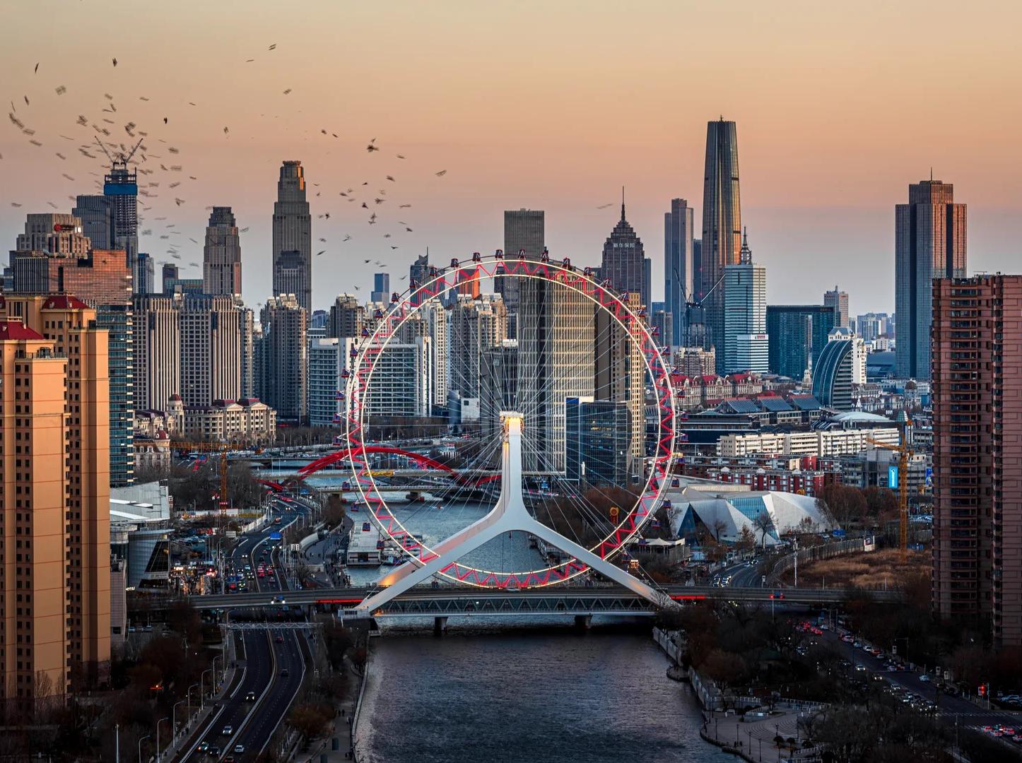 Tianjin Eye landmark Ferris wheel and city skyline