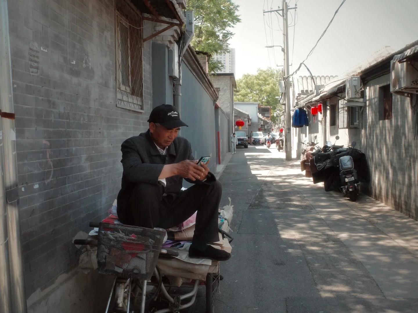 Ordinary local life in old Beijing hutong alley