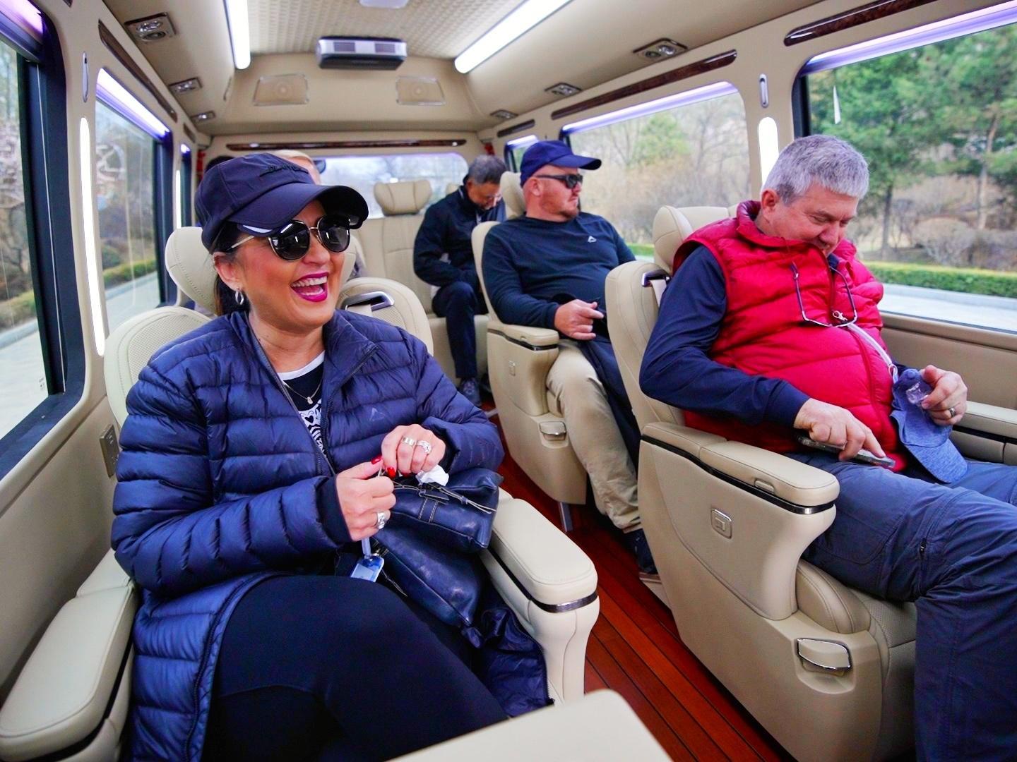 International tourists travelling in luxury tour vehicle